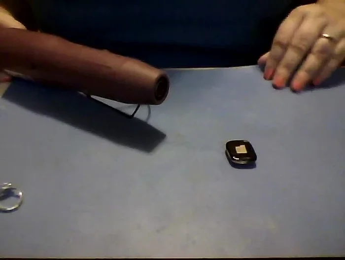 Use the heat gun to melt the bail bond. Be careful not to melt your work surface!