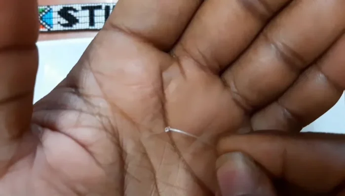 Attach one end of the lock to the fishing line.