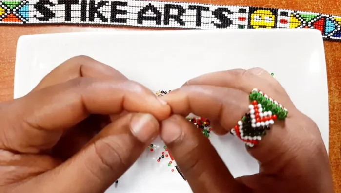 Secure the lock with a bead and a tight knot.