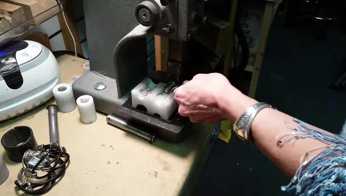 Drill a hole: Drill a hole in the end of the bent silverware.