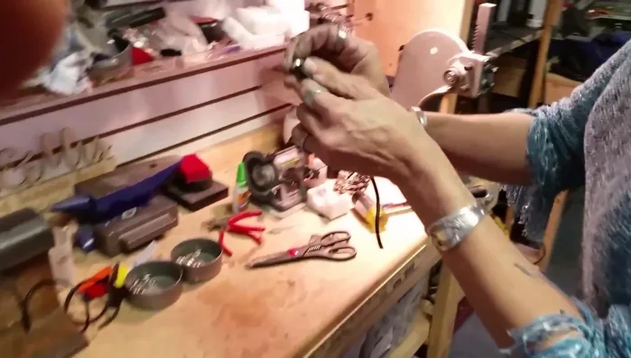 Glue the double end cap: Apply a small drop of Gorilla Super Glue Gel to each side of the double end cap and insert the leather cords. Wiggle the cords to spread the glue.