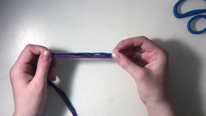 Cut three strings of each of your three chosen colors. The length should be from your arm to the center of your chest.