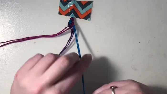 Repeat steps 3-7 one final time, starting with the remaining two color groups and using backward knots.