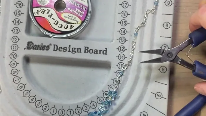 Add clasp: Attach the swan clasp to one end of the necklace.