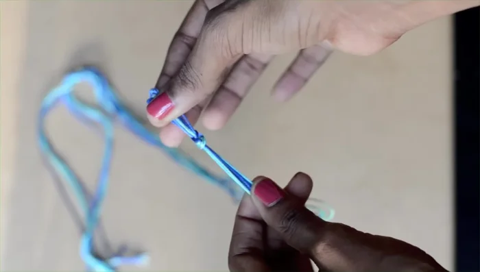 Secure the bracelet: Use tape or a clipboard to keep the bracelet secure while working.