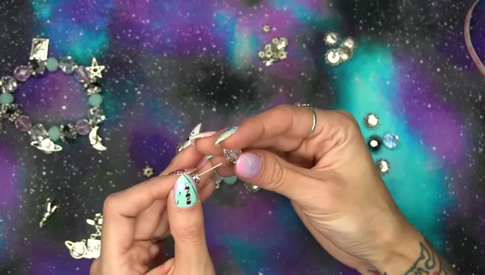 String beads and bead caps onto the elastic cord, following your chosen pattern.