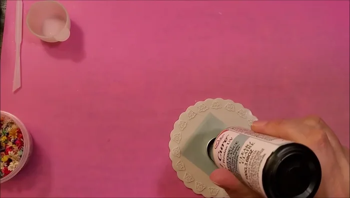 Apply a thin layer of UV resin to the taped ring, use a heat gun to remove bubbles, and cure for 90 seconds.