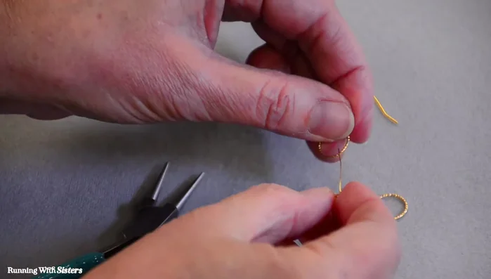 Secure the ring to the briolette hanger with two wraps of wire and trim the excess.