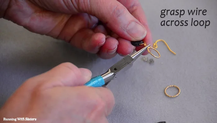 Secure the ring to the briolette hanger with two wraps of wire and trim the excess.