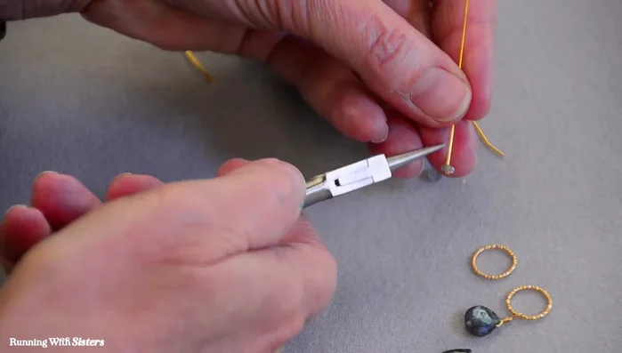 Attach the rondelle to a gold ring and secure it with two wire wraps.