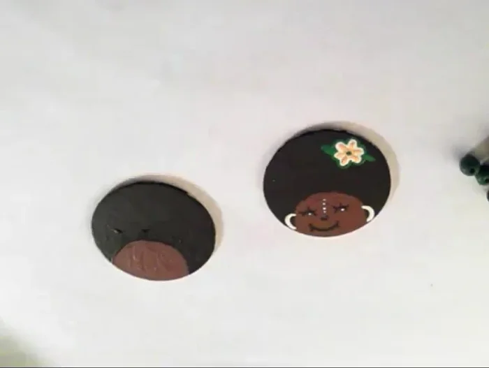 Add a simple flower design using yellow and green paint.