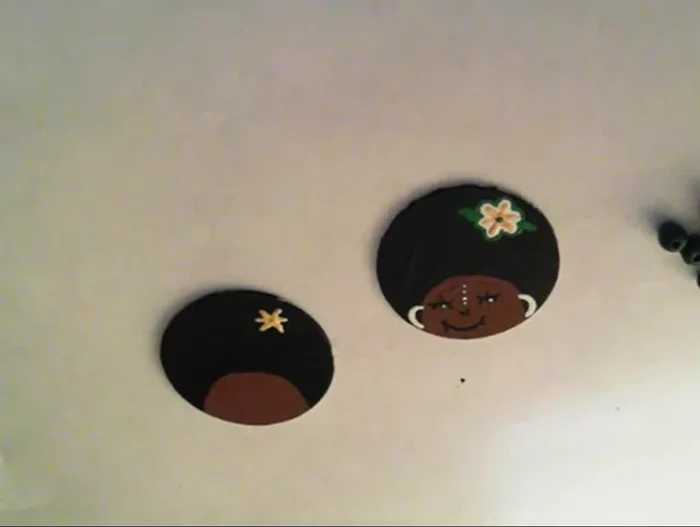 Add small details to the sides of the face. 