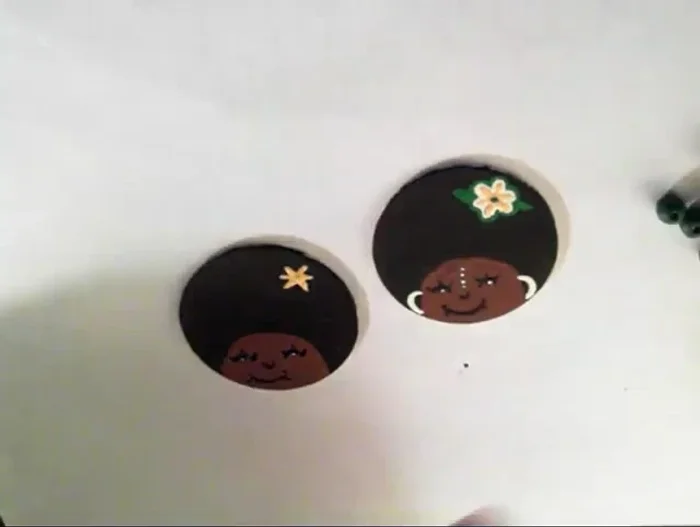 Add small details to the sides of the face. 