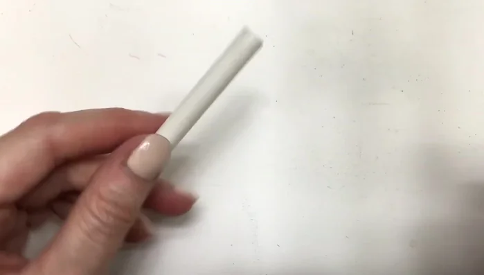 Use an exacto knife to cut two straight lines to create the earring hoops.