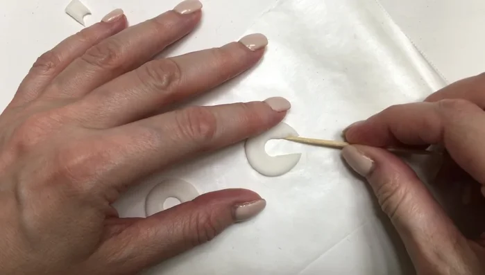 Smooth the edges of the hoops again using a toothpick.