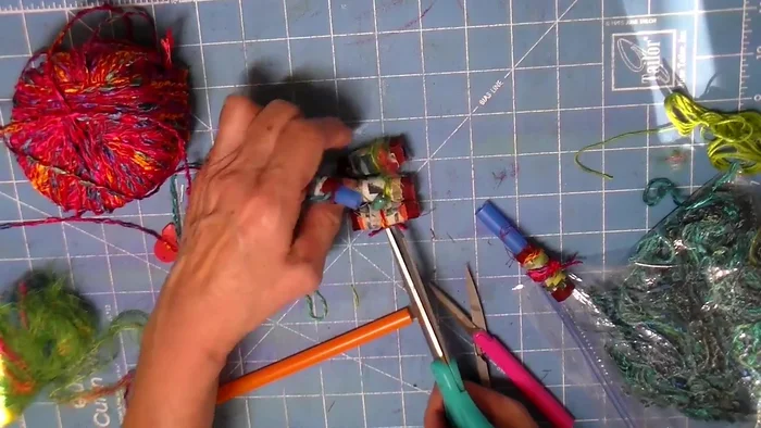 Cut and arrange fabric: Cut excess fabric close to the straw, avoiding the plastic showing. Arrange the fabric pieces to your liking.