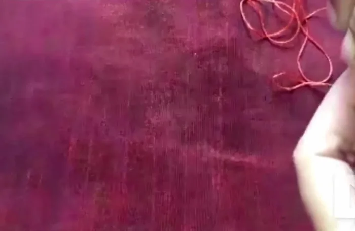 Continue threading: Thread consistently around the ring until you've covered it entirely. Use a knot to prevent unraveling.