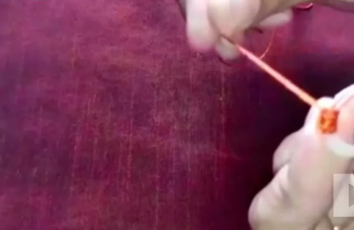 Continue threading: Thread consistently around the ring until you've covered it entirely. Use a knot to prevent unraveling.