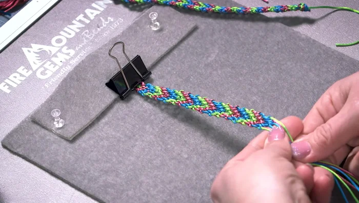 Thread one or two cords through the loops at the other end and tie to secure the bracelet.