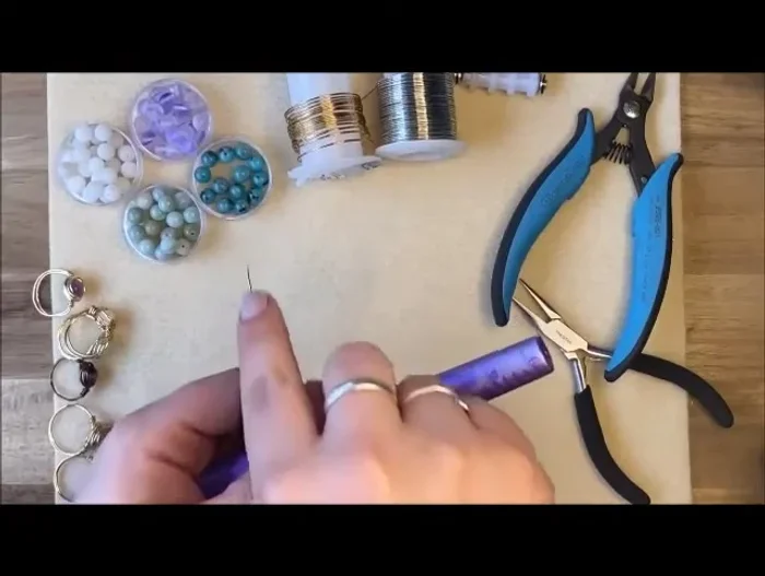 Form the ring band: Wrap the wire around the ring mandrel twice. Separate the wires on the back and leave approximately 2-3 inches of wire at the end.