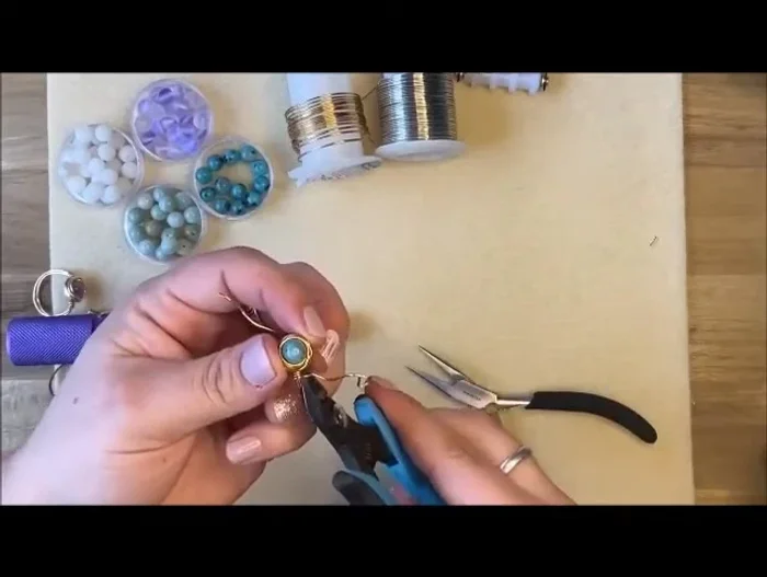 Finalize: Use flush cutters to trim the excess wire, ensuring the cut is flush against the ring band. Use pliers to neatly tuck in the ends. Reshape the ring if necessary using the mandrel.