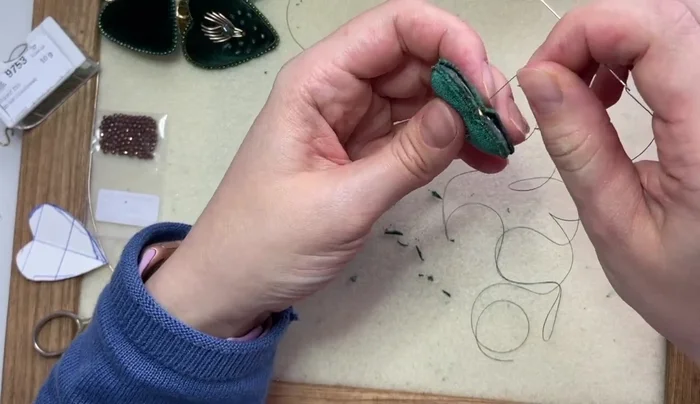 Finish the edges of the earrings by adding more seed beads to secure and embellish.