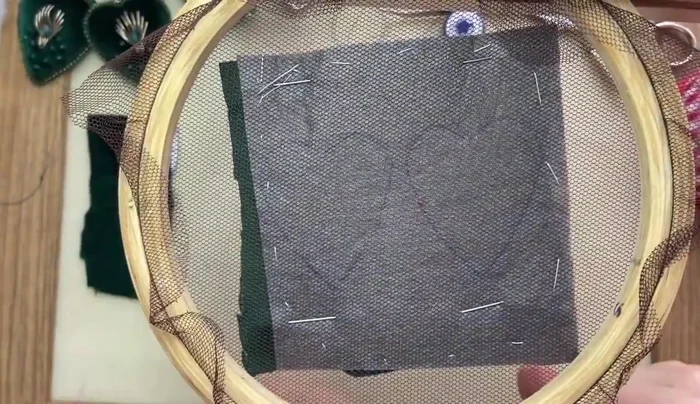 Stitch the velvet onto the felt, creating the heart shape. Leave a small gap for filling.