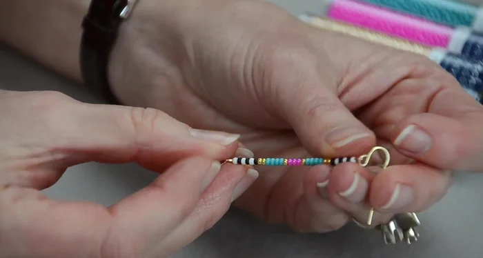 Adjust the leaf charm: Use chain nose pliers to adjust the orientation of the top loop so the leaf charm hangs correctly.