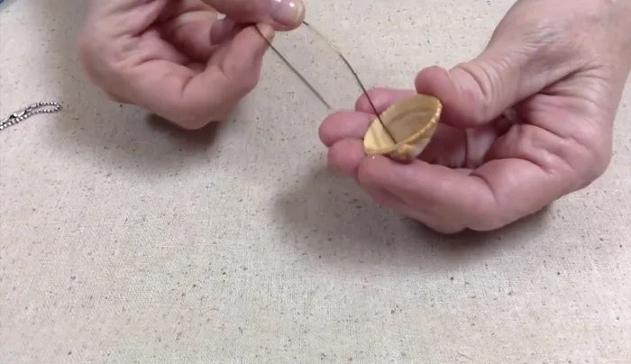 Cross the wires and twist them together tightly to join them as one piece. Neatness isn't crucial at this stage.