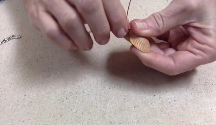 Cross the wires and twist them together tightly to join them as one piece. Neatness isn't crucial at this stage.