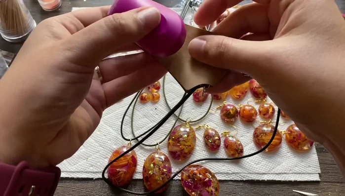 Package the earrings and necklaces using cardboard holders.