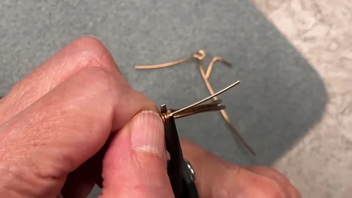 Carefully use flush cutters to remove excess wire, leaving a clean finish. Push the remaining wire end into the wraps.