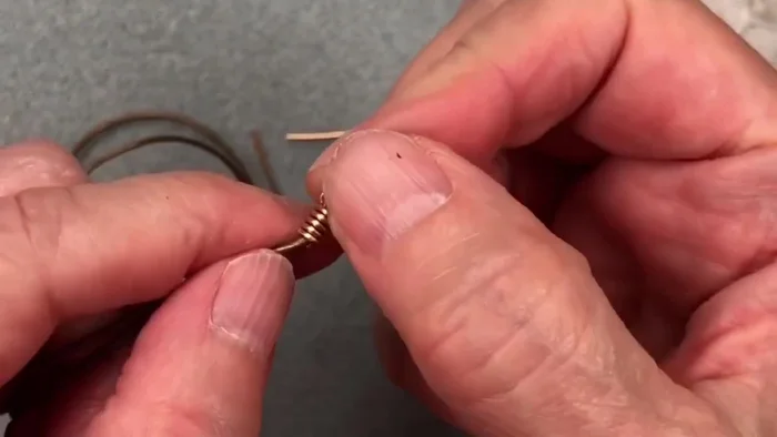 Carefully use flush cutters to remove excess wire, leaving a clean finish. Push the remaining wire end into the wraps.