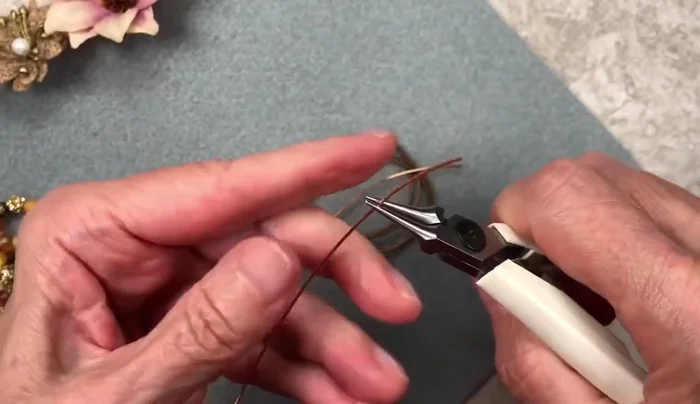 Repeat steps 2 and 3 for the second wire piece, ensuring both loops are identical.