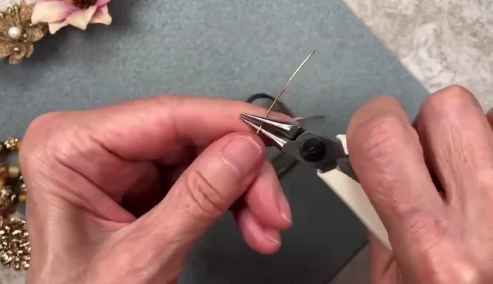 Repeat steps 2 and 3 for the second wire piece, ensuring both loops are identical.