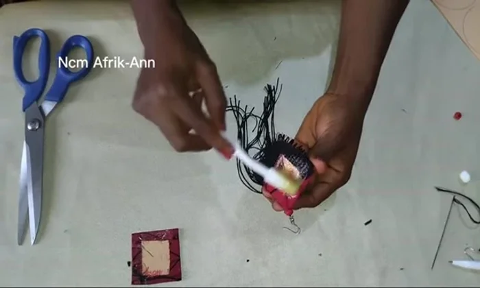 Join the two identical earring pieces together.