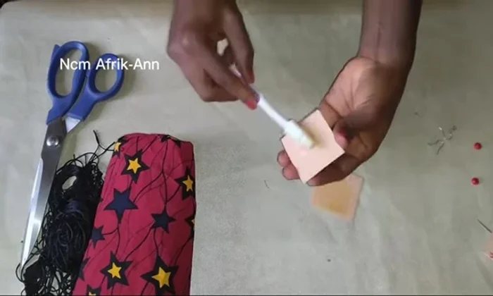 Apply adhesive gum to the strawboard shapes.