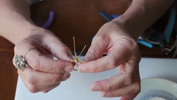 Open the loops slightly to prepare for beading.