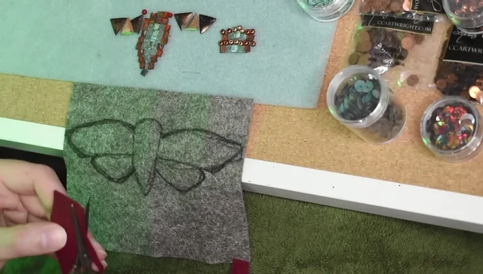 Add red seed beads for the eyes.