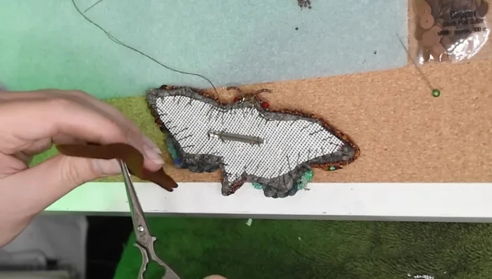 Add a final backing of felt, securing it with a blanket stitch.