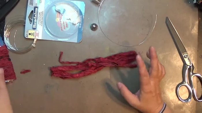 Prepare silk strands: Cut several 8-inch lengths of silk fabric.