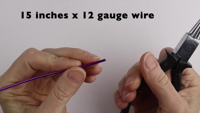 Assemble the flower: Bring all petals together, adjusting their positions. Secure using a ring cone to twist the wire several times, cut and tuck the excess wire.