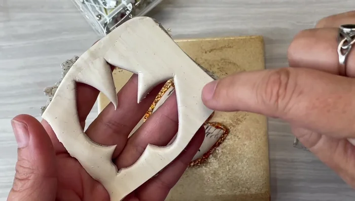 Prepare a clay backing for the brooch pin.