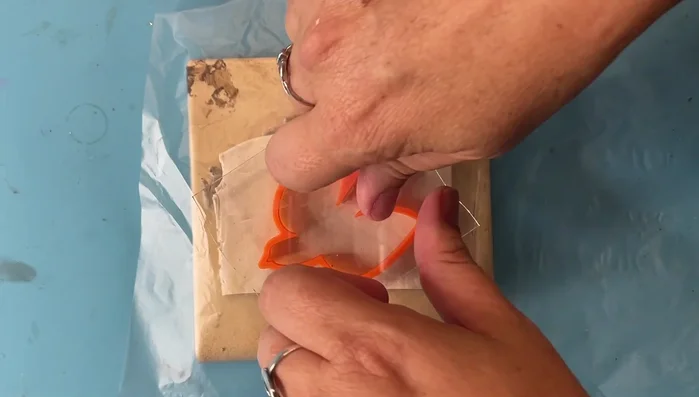 Clean up excess clay around the bird shape.