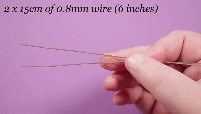 Prepare wire lengths: 2 lengths of 0.8 mil wire (15cm each), 1 length of 0.4 mil copper wire (50cm), and a length of 0.4 mil silver wire (attached to reel for weaving).