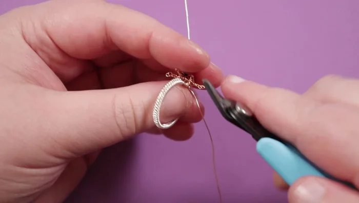Finish off the weaving wires by wrapping around a base wire, tucking the ends away to avoid snagging.