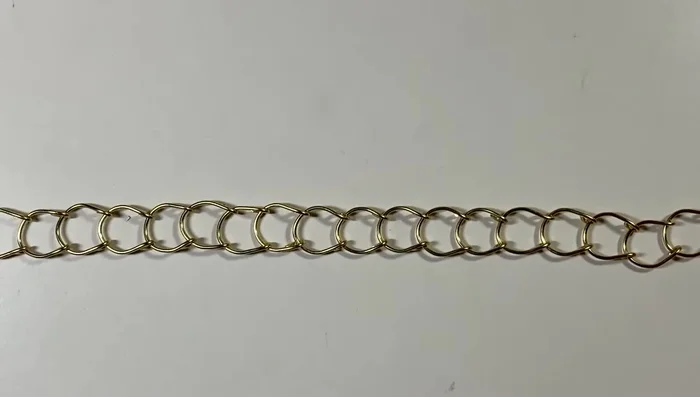 Create a clasp using 2.5 inches of 20 gauge wire: fold in half, flatten slightly, create loops at both ends.