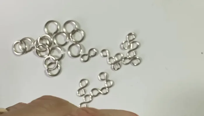 Assemble the chain by connecting jump rings and figure eight links.