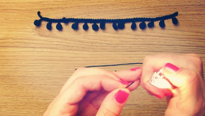 Burn the tips of two pieces of nylon cord to create sharp points.