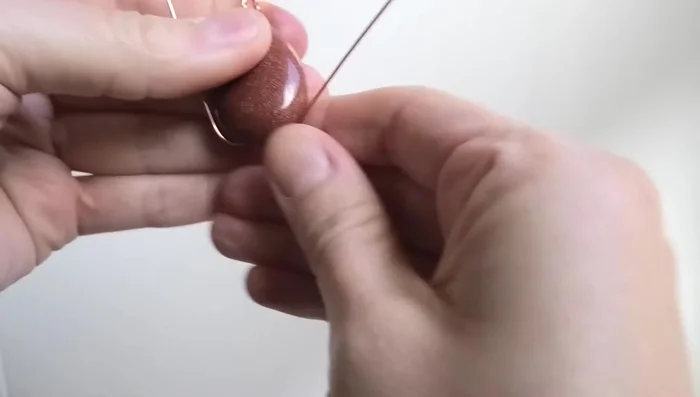 Adjust the bail to ensure it is even and secure.